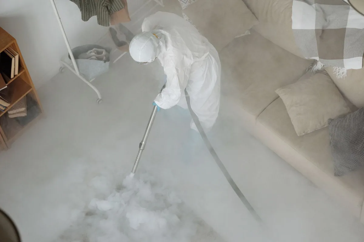 Biohazard cleanup technician in protective equipment, Gulfport, MS
